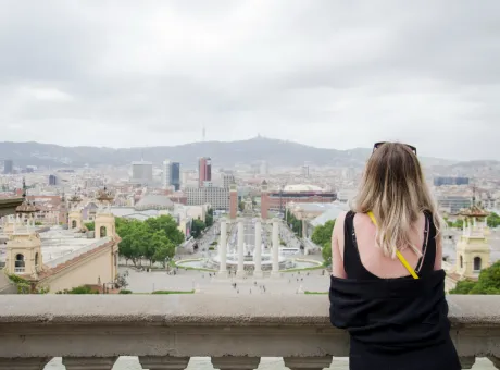 beautiful young girl back black shirt with long hair looking barcelona city panorama from national museum catalunya cascade fountains barcelona catalonia spain