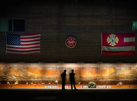 people standing front memorial new york manhattan