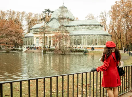 woman looks cristal palace retiro park madrid